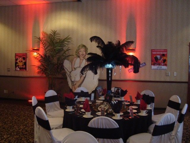 A table set for a party with a picture of marilyn monroe on the wall