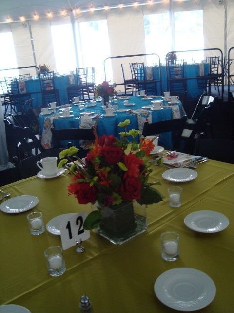 A table with a vase of flowers and the number 12 on it