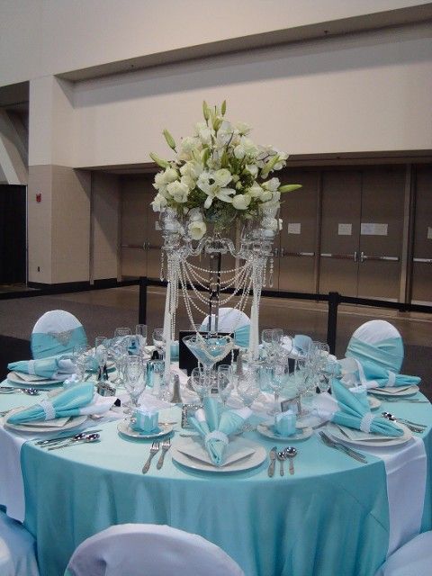 A table with a vase of flowers on it