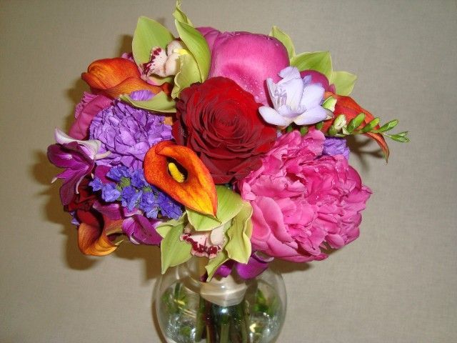 A vase filled with purple and pink flowers