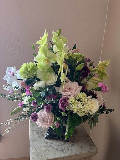 A vase filled with flowers is sitting on a table.