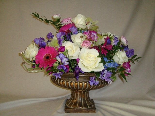 A vase filled with flowers is sitting on a table