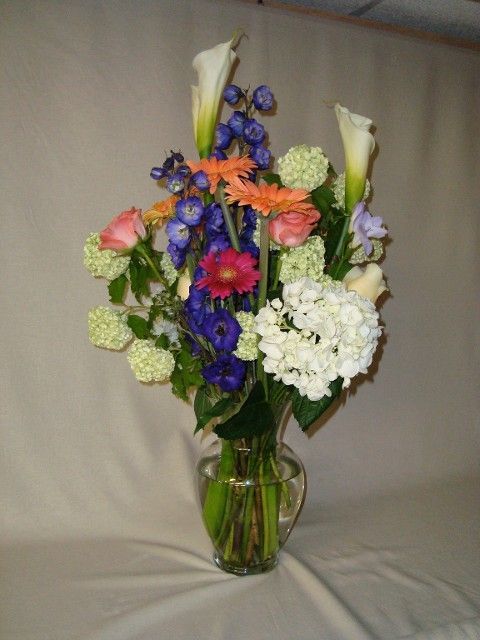 A vase filled with flowers is sitting on a table