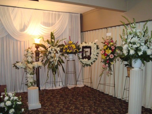 A room decorated with flowers and a picture frame