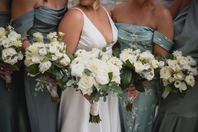 A bouquet of red flowers in a vase on a table