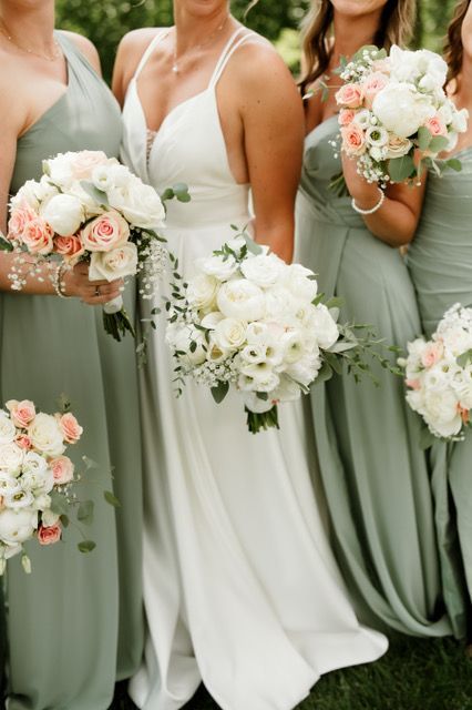 A bouquet of red yellow and purple flowers in a vase