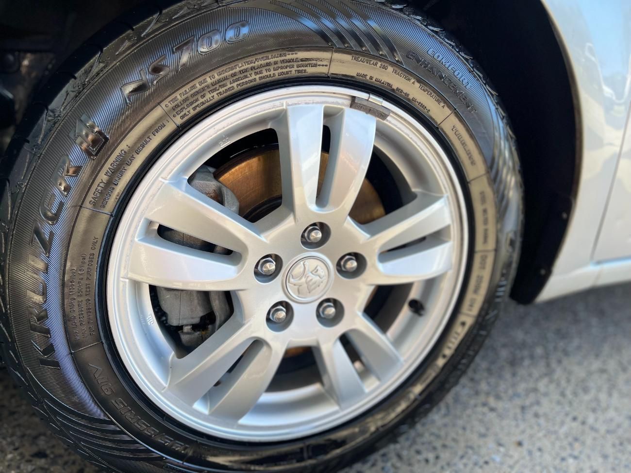 A Close Up of a Car Wheel With a Tire on It — Detail World Car Detailing in Coffs Harbour, NSW