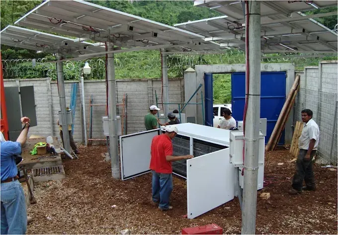 A group of men are working on a solar panel installation