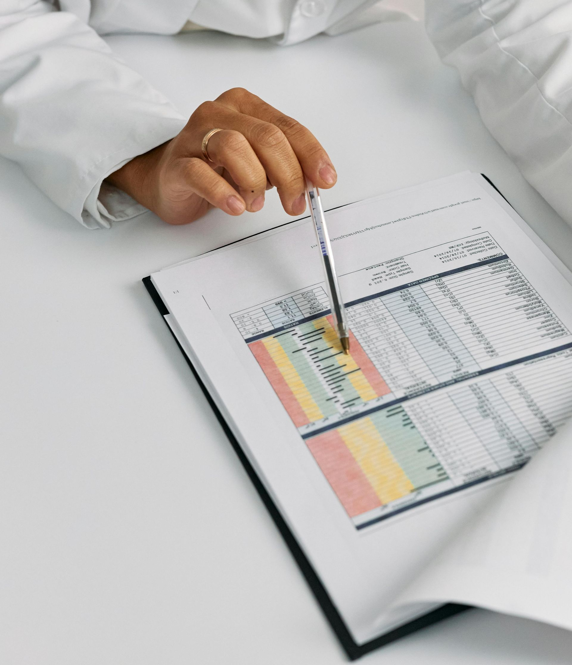 pen pointing to financial report