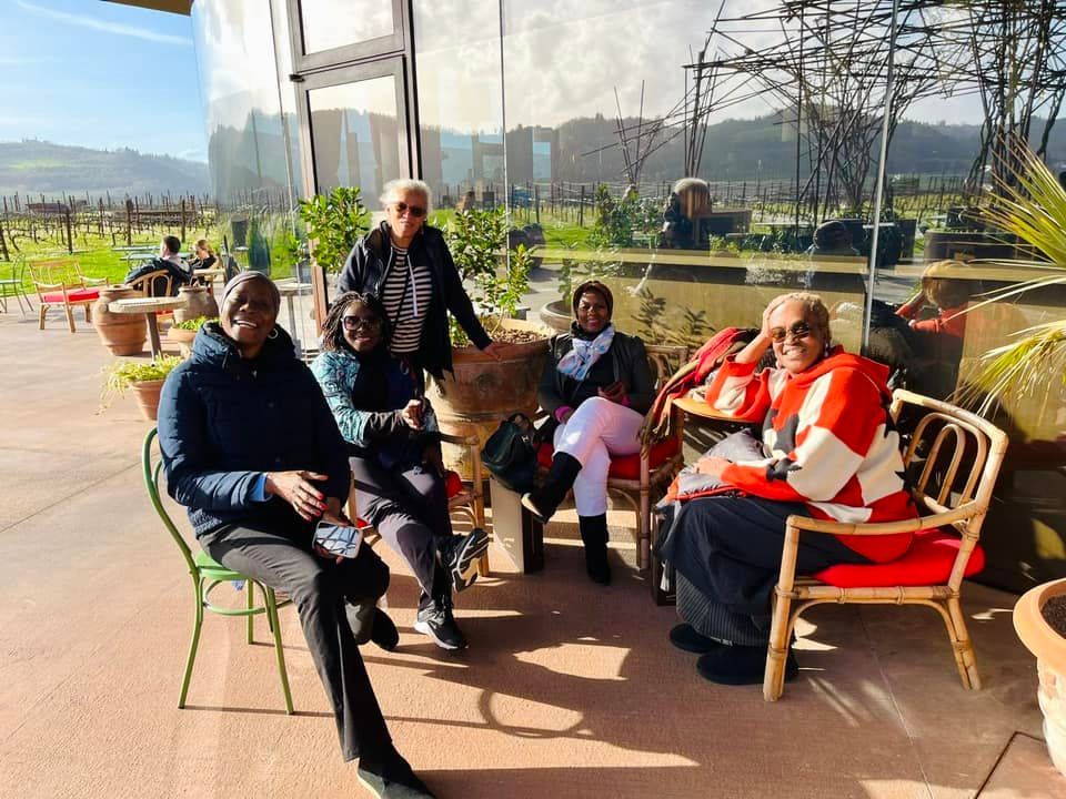 A group of people are sitting on a patio.