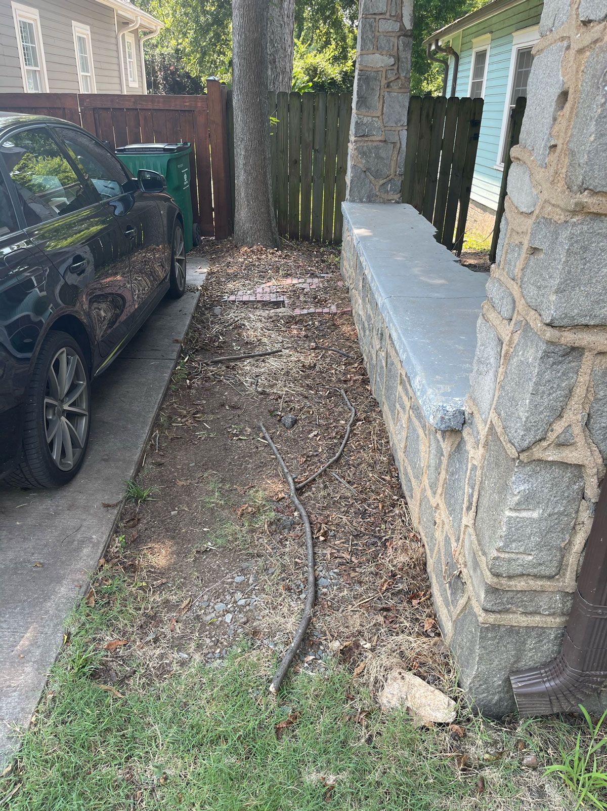 Black Car Beside A Dirt | Charlotte, NC | Elephant Trunk Tree and Landscaping