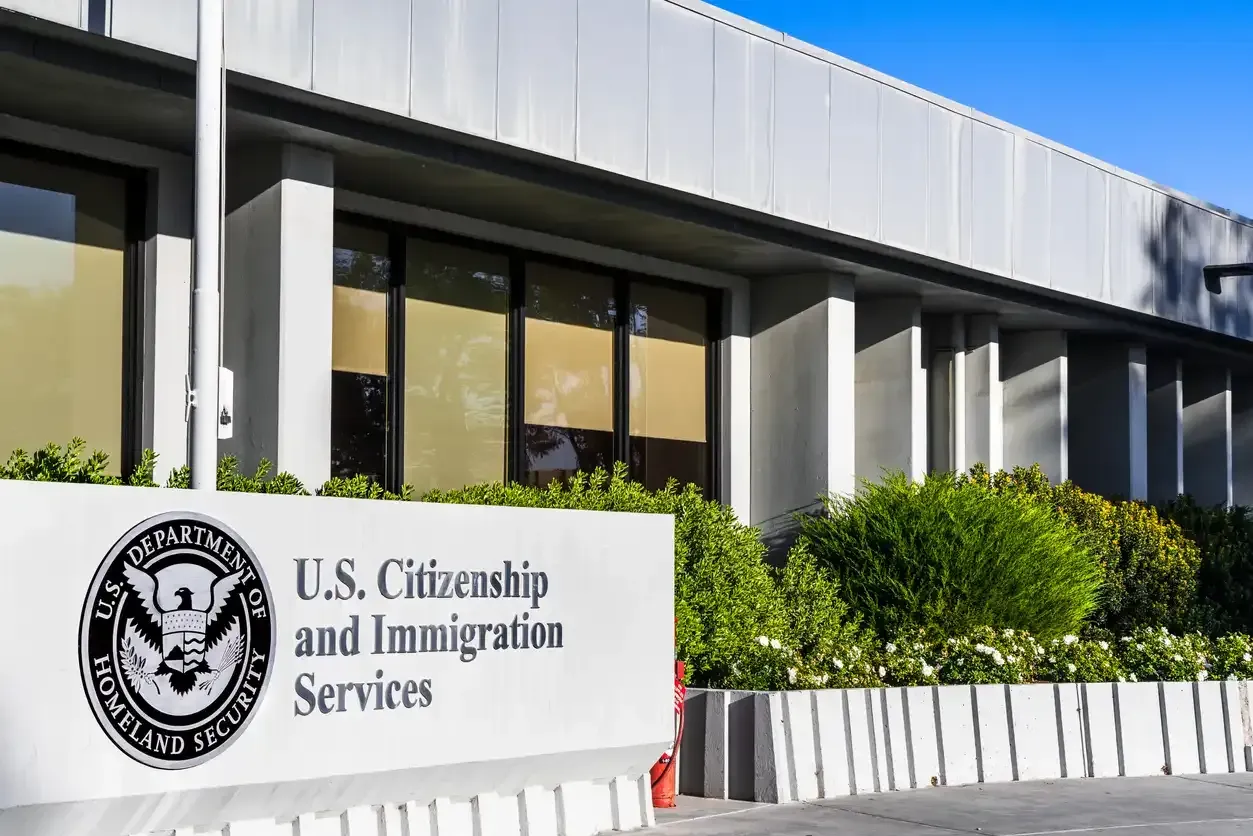 A building with a sign that says u.s. citizenship and immigration services
