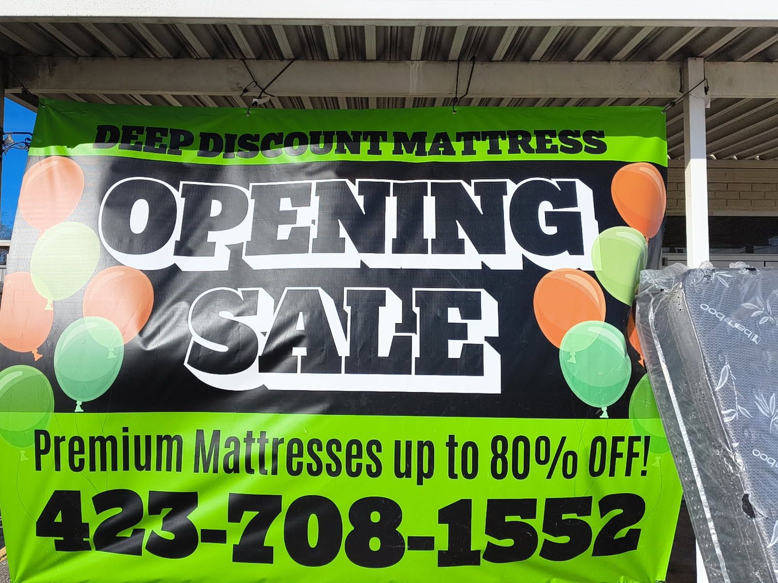 Green banner: "Deep Discount Mattress - Opening Sale" with balloons and phone number.