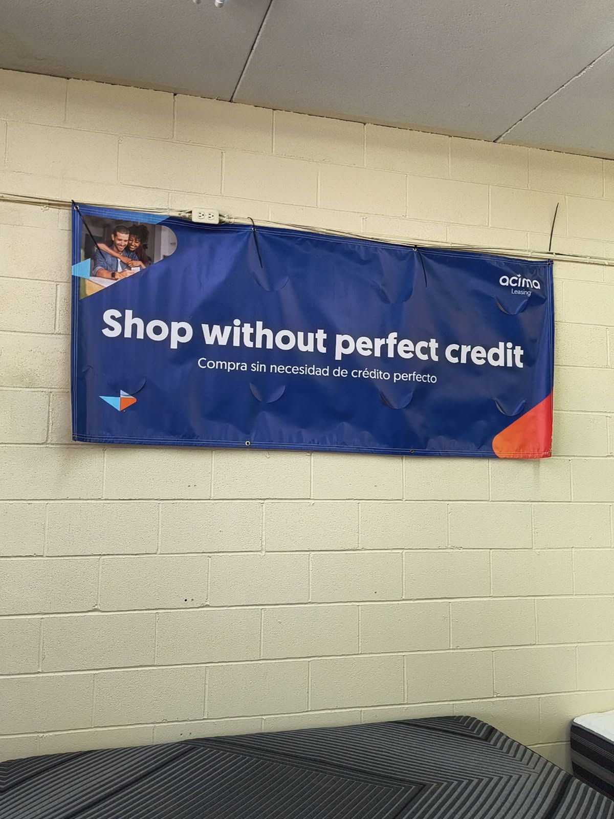 Blue banner on a brick wall: