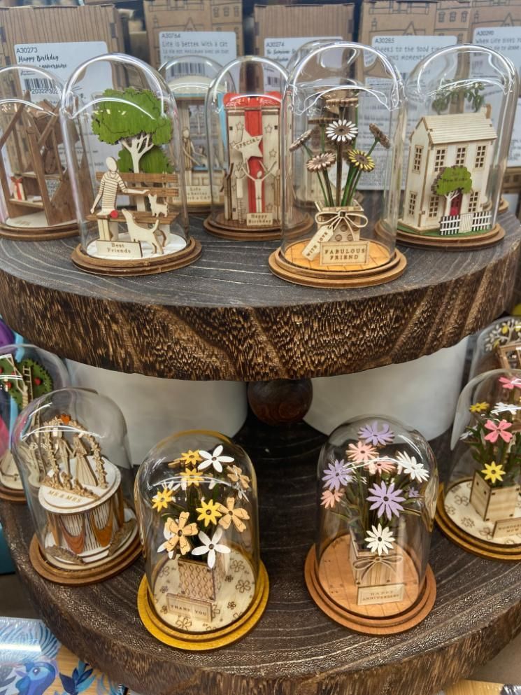 A Display of Miniature Houses and Flowers in Glass Dome Containers — Nambour Heights Gifts & Christmas Shop in Nambour, QLD