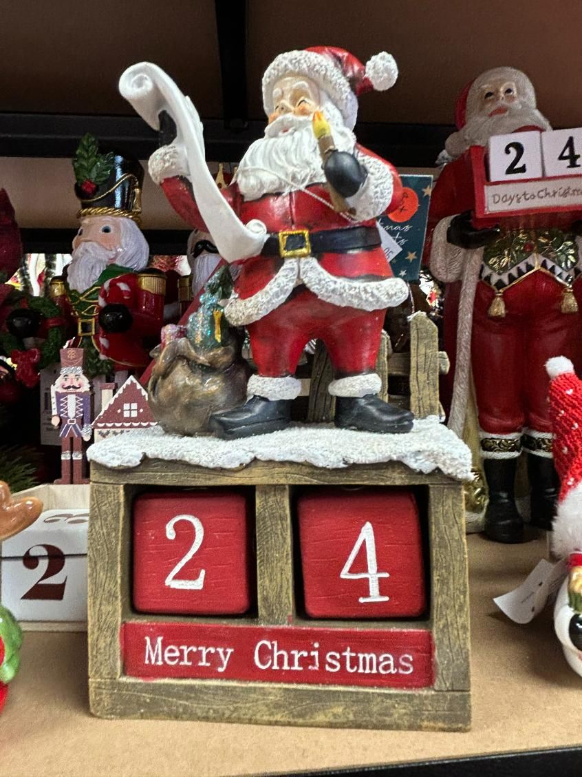 A Christmas Calendar With a Santa Claus Figurine on Top of It — Nambour Heights Gifts & Christmas Shop in Nambour, QLD