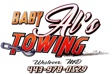 a logo for baby al 's towing with a phone number
