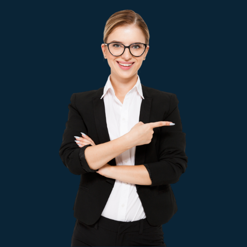 Woman in business suit, glasses, smiling, pointing to the right, arms crossed.