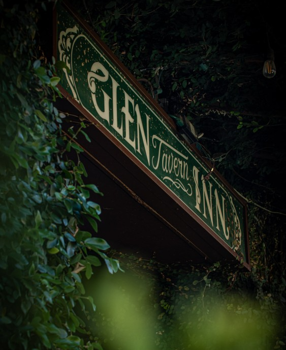 Green and gold sign for 