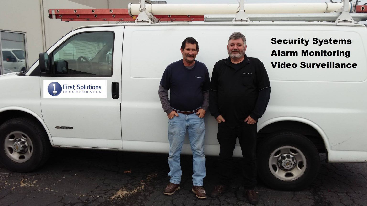 Two men stand in front of a white van – Sacramento, CA – First Solutions Incorporated