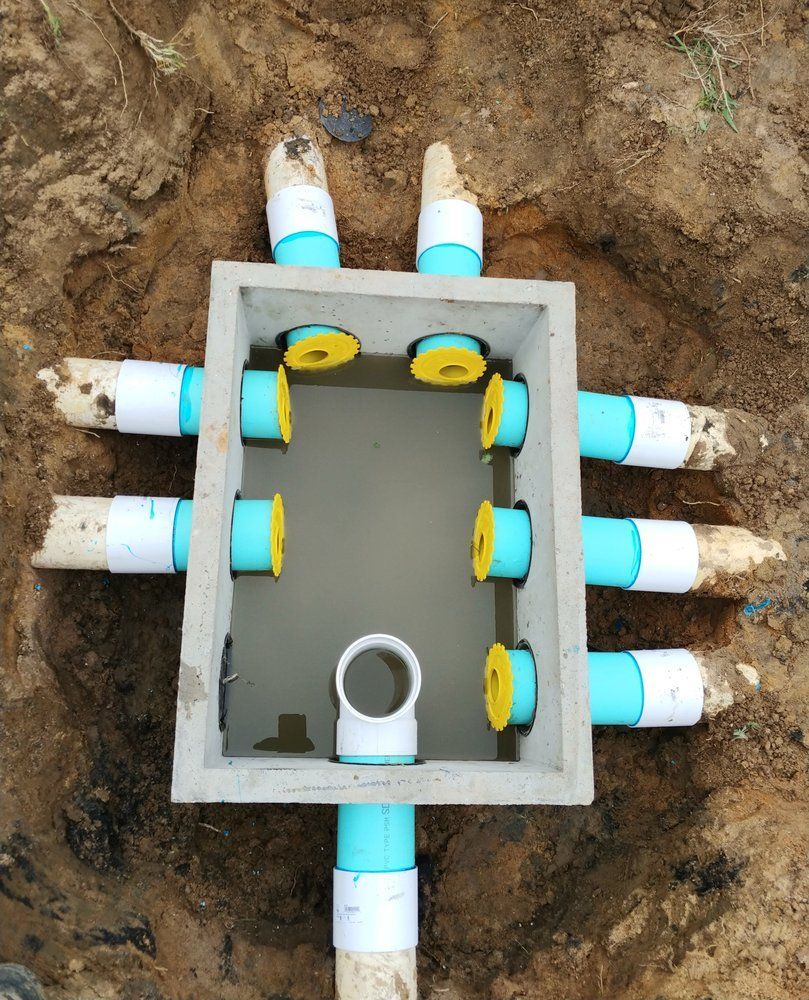 a concrete box with blue and white pipes in it