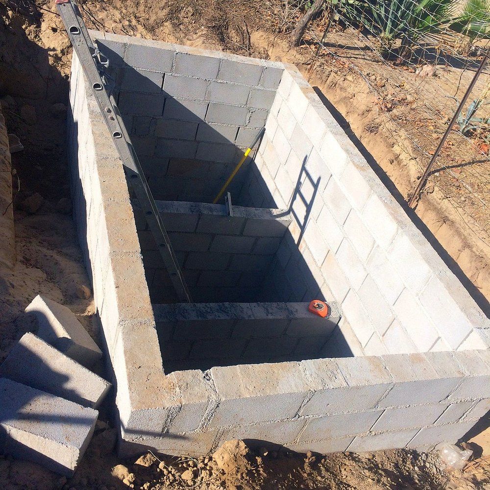 a brick wall with a ladder going into it