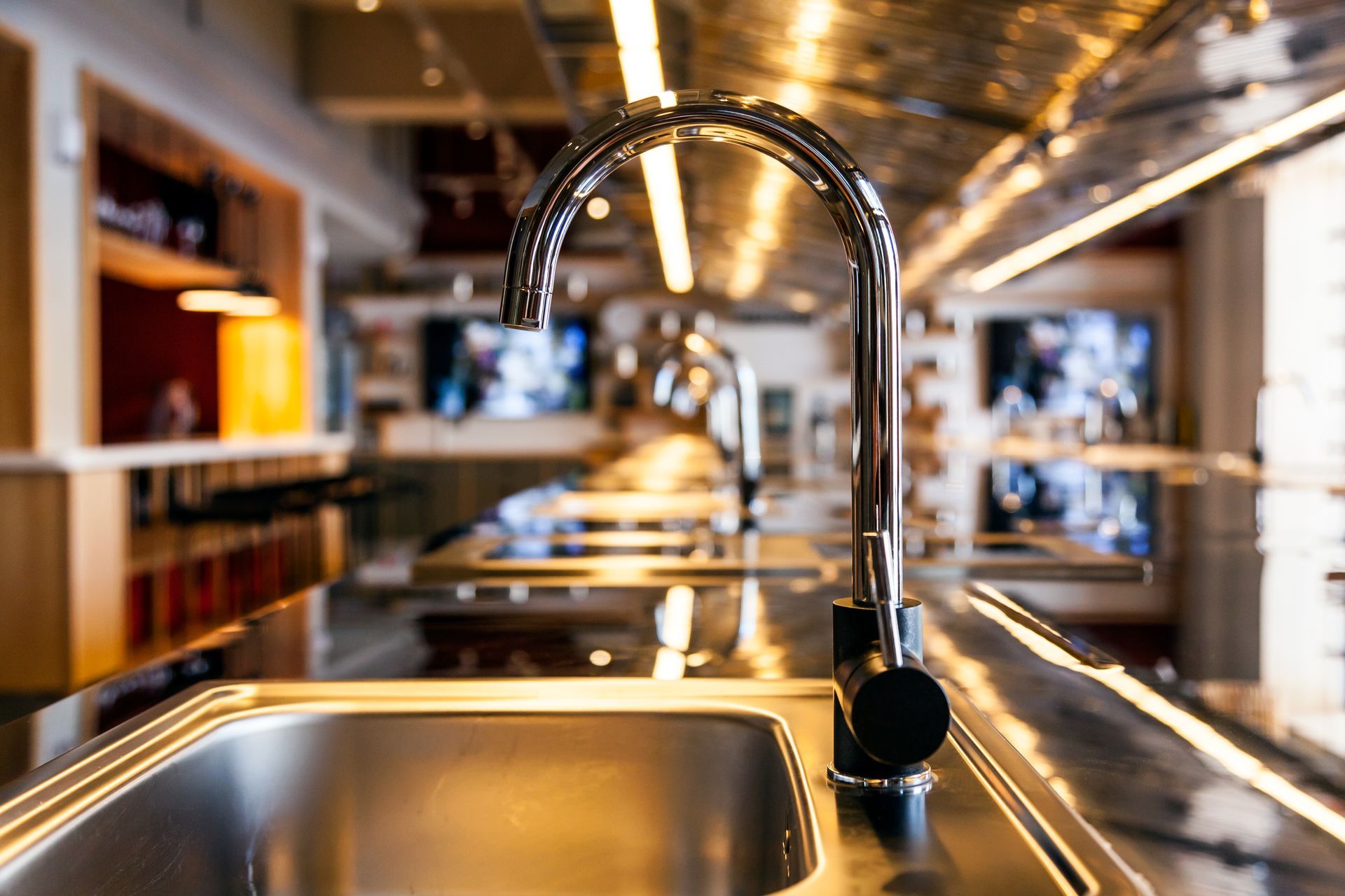 a stainless steel sink with a faucet in a kitchen .