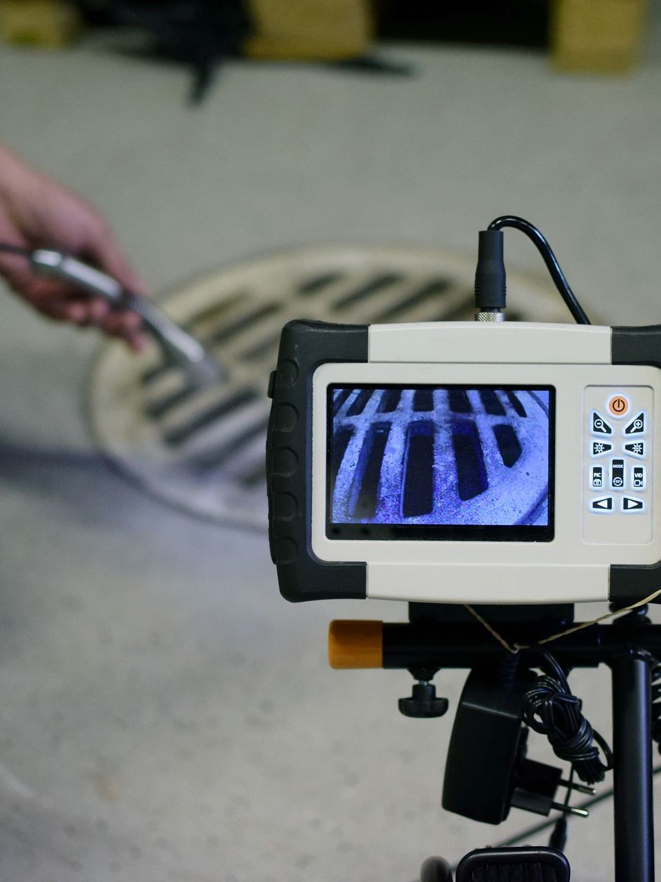 a manhole cover is being inspected by a camera