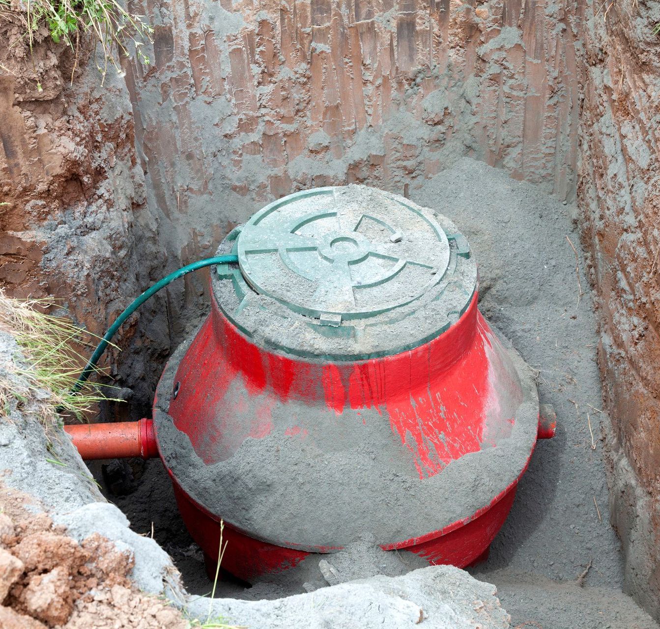 a black bucket with a white hose inside of it .