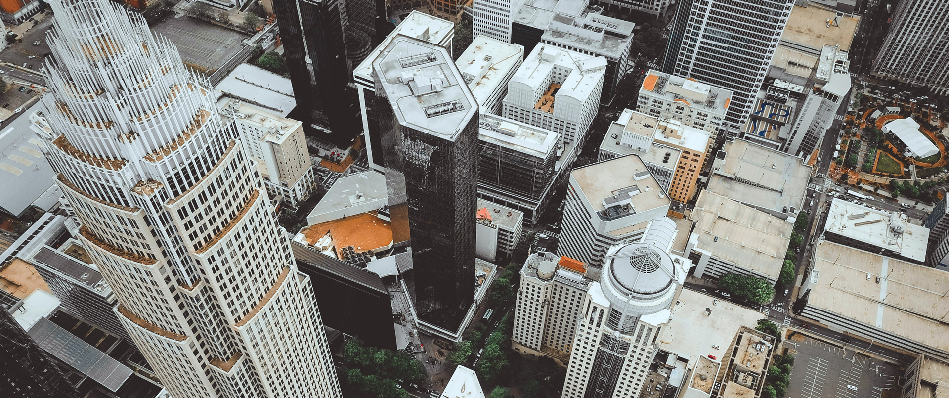 An aerial view of a city with lots of tall buildings.