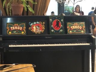 A piano with three boxes on it that say tahoo on them.