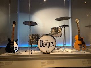 A drum set with the beatles logo on it