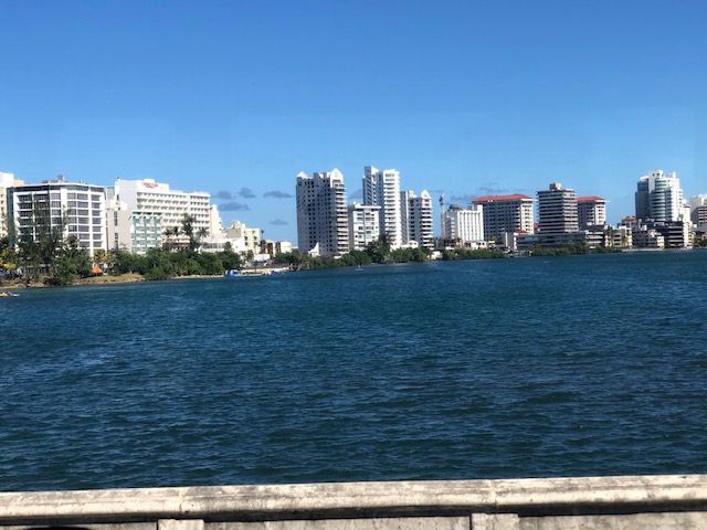 A large body of water with a city in the background