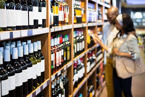 Couple Picking Wine in the Shelf — Cheyenne, WY — Lincolnway Super Pawn