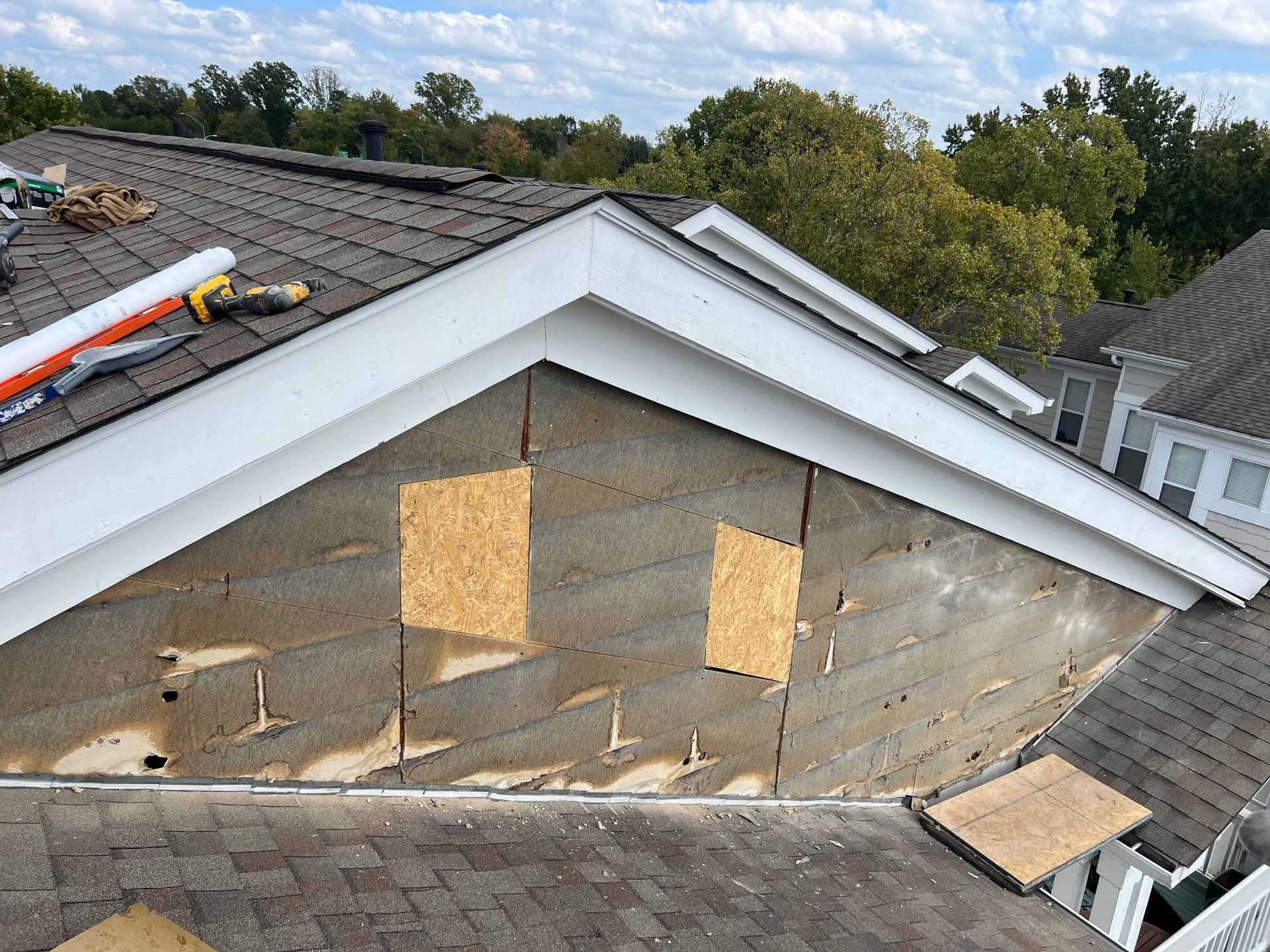 A house with a roof that is being repaired