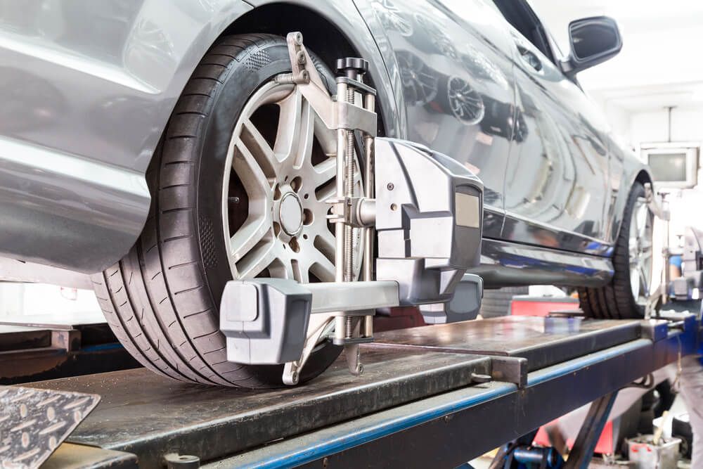 Car Wheel Being Aligned with A Machine — Experienced Mechanic in Canberra