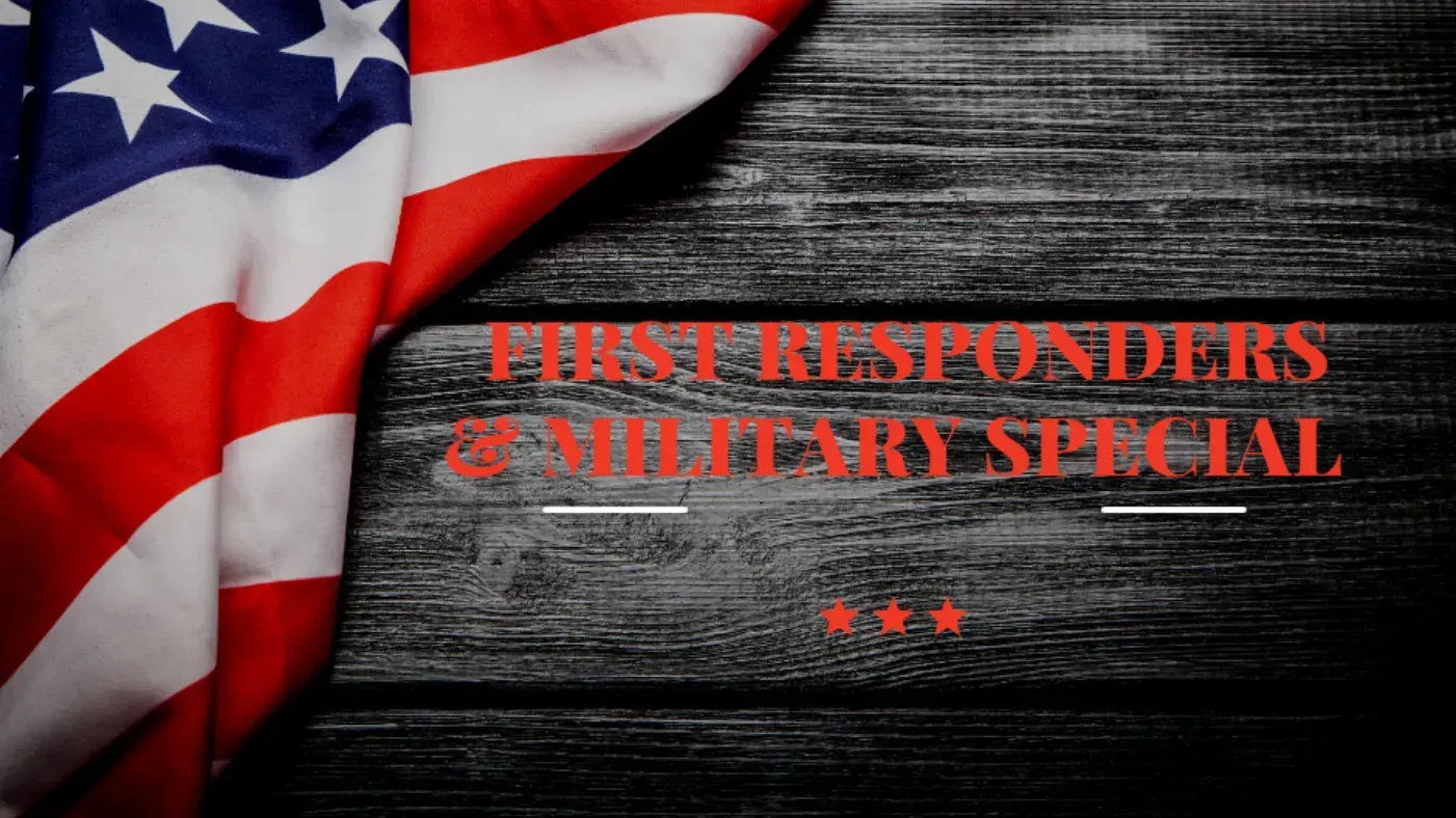 American flags waving in a field at sunset, likely a memorial or cemetery.