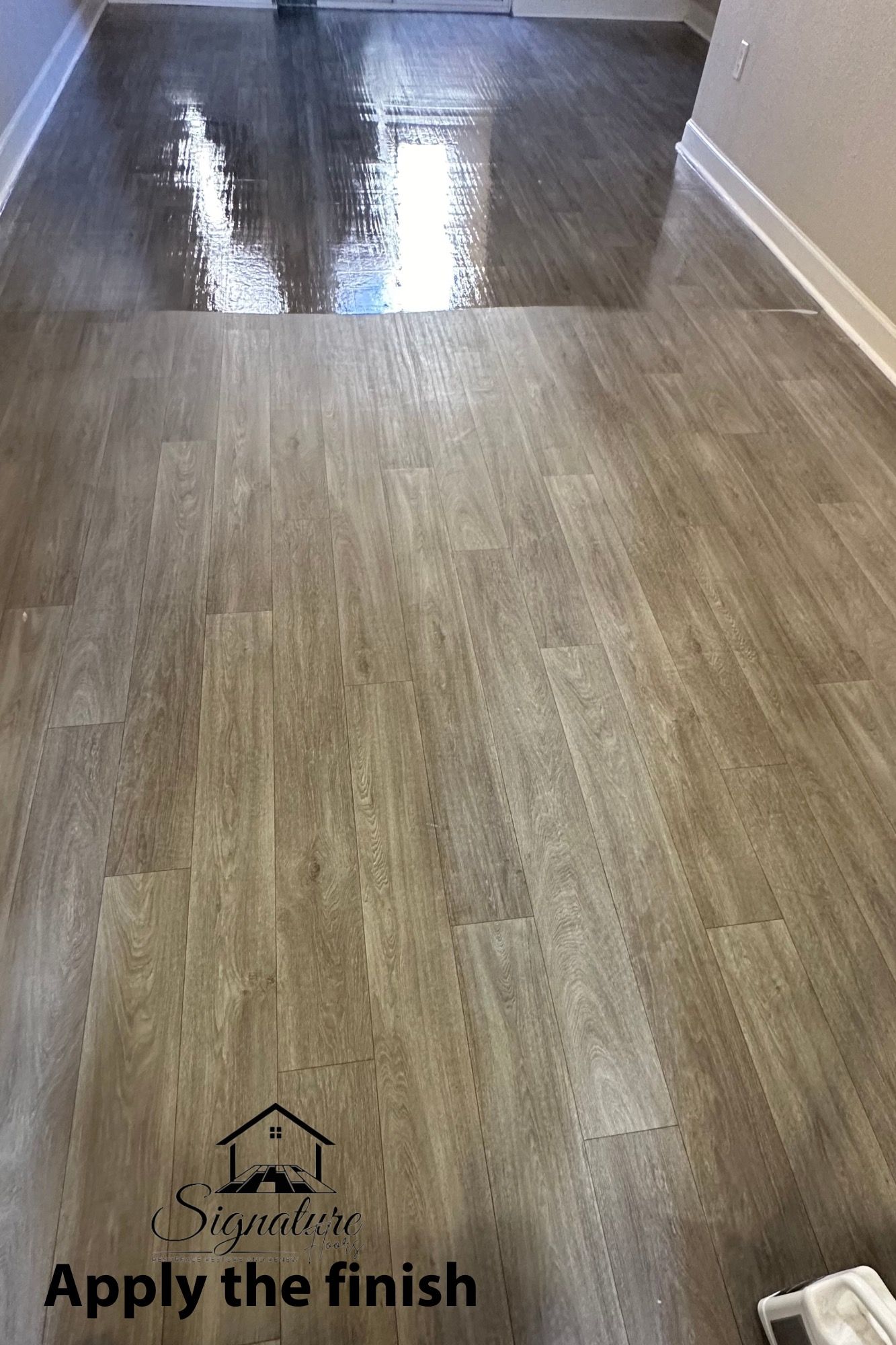 A room with a wooden floor and a picture of how to apply the finish.