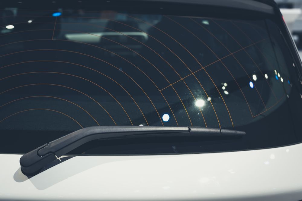 A Close Up of a Car Windshield With a Wiper Blade — Crakka Windscreens in Harrington, NSW
