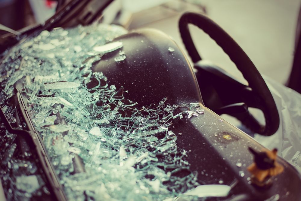 A Car With a Broken Windshield and Steering Wheel — Crakka Windscreens in Taree, NSW