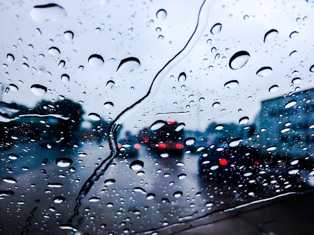 A Car Windshield With a Lot of Rain Drops on It — Crakka Windscreens in Wingham, NSW