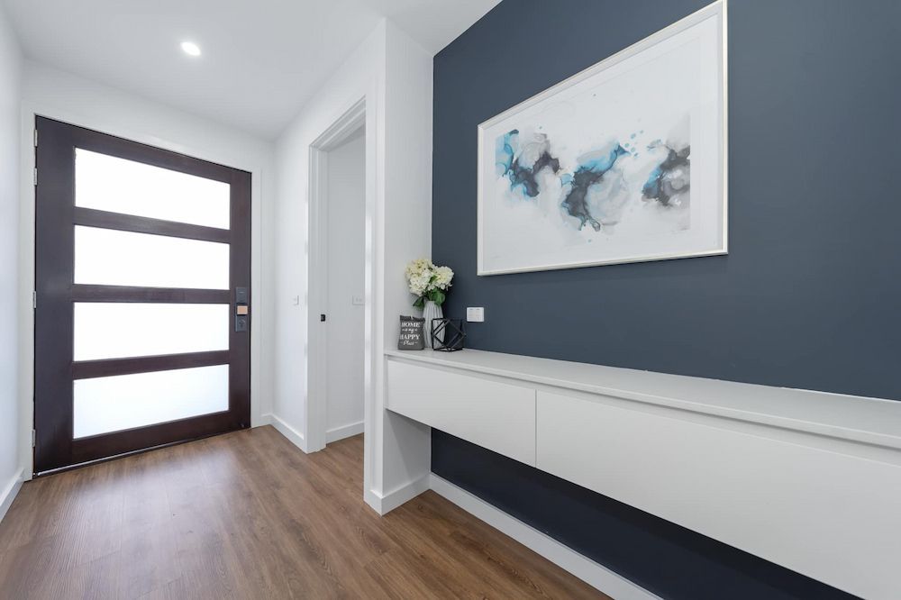 A Hallway With A Picture On The Wall Above The Door — ASM Joinery In Fyshwick, ACT