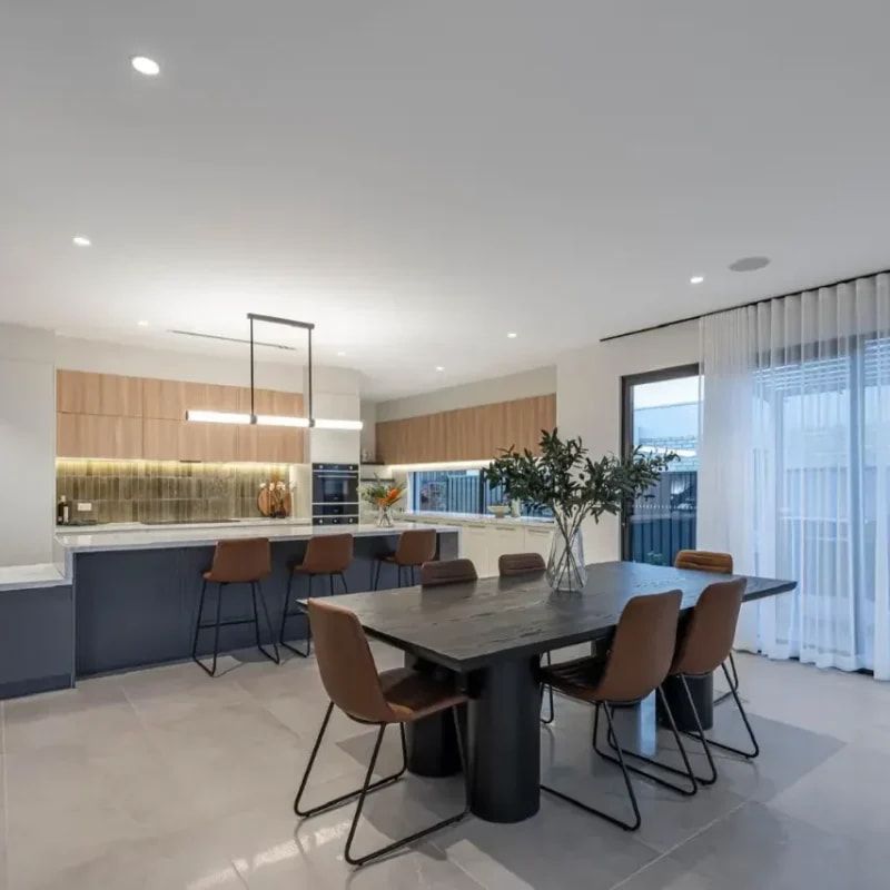 A Kitchen With A Table And Chairs In It — ASM Joinery In Fyshwick, ACT