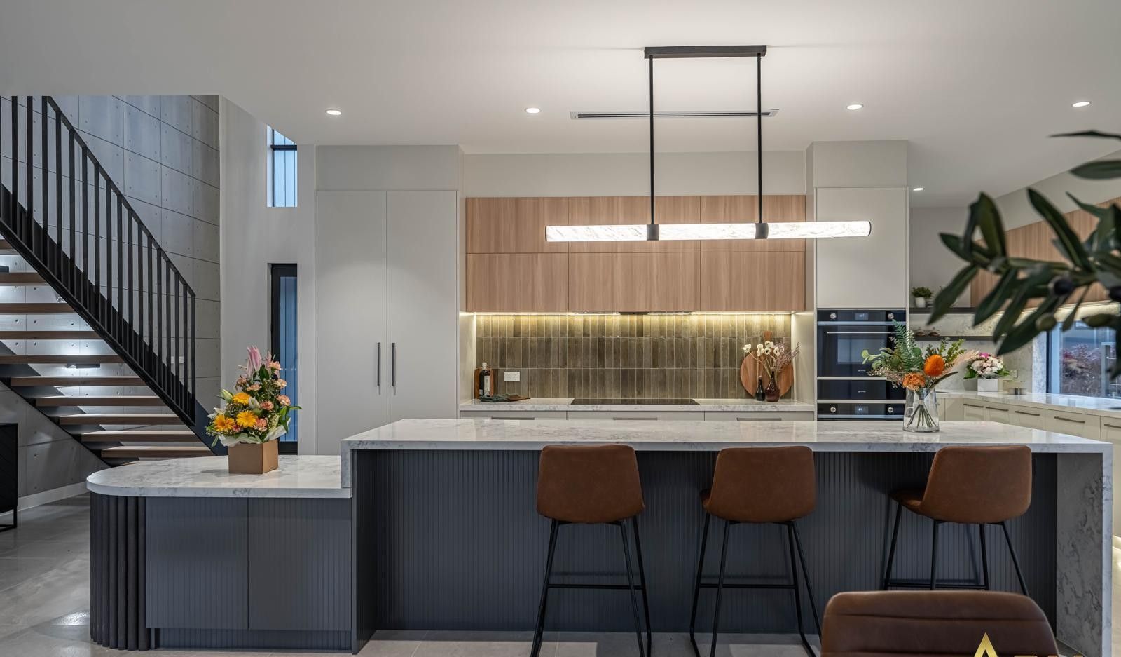 A Kitchen With Wood Cabinets And A Large Island — ASM Joinery In Fyshwick, ACT