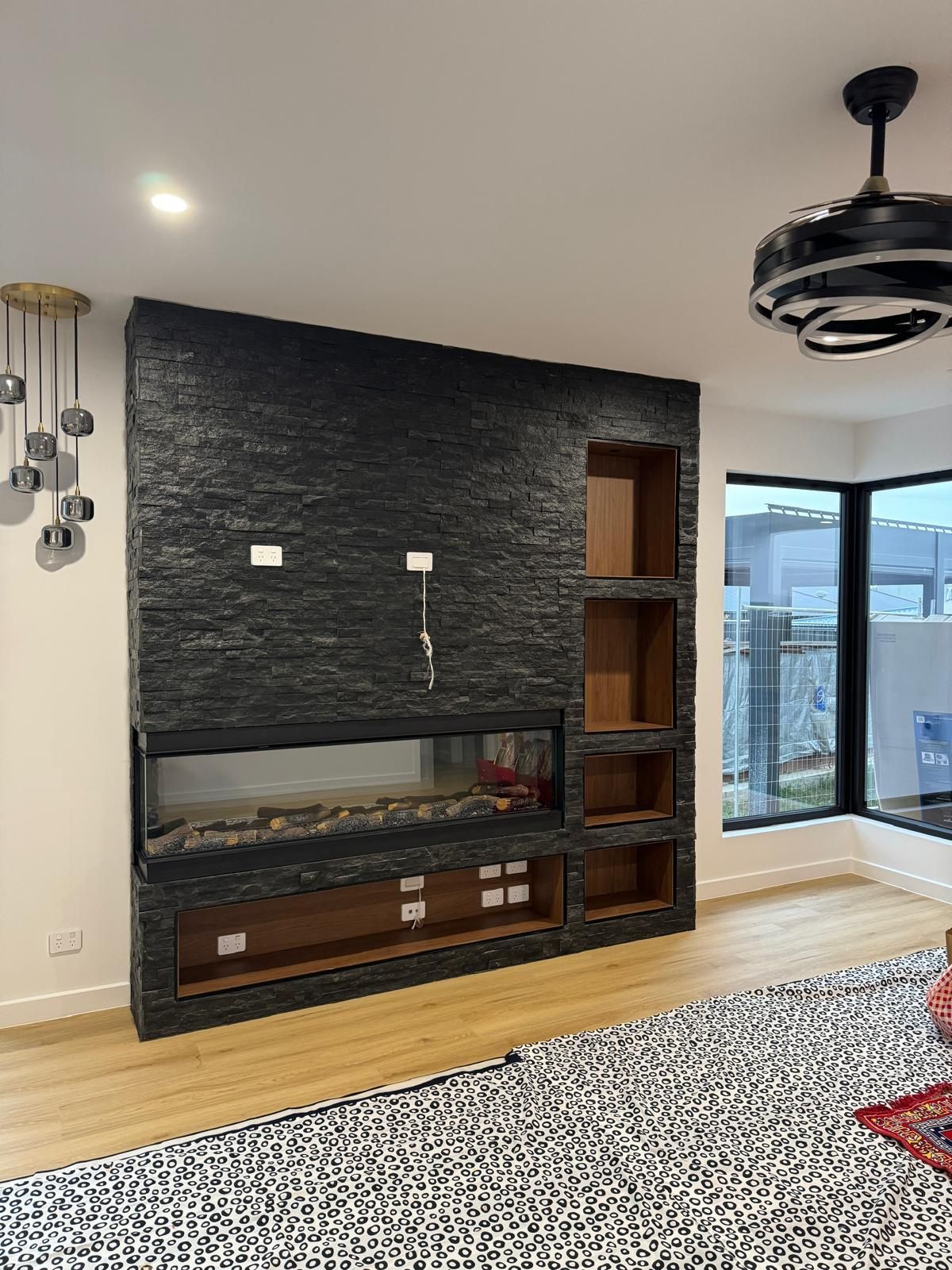 A Living Room With Fireplace and Cabinets — ASM Joinery In Fyshwick, ACT