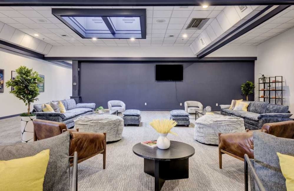 A living room filled with furniture and a television.