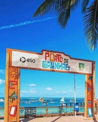 A sign on a beach that says porto de galinhas