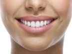 woman showing white teeth — Dental care service in East Brunswick, NJ