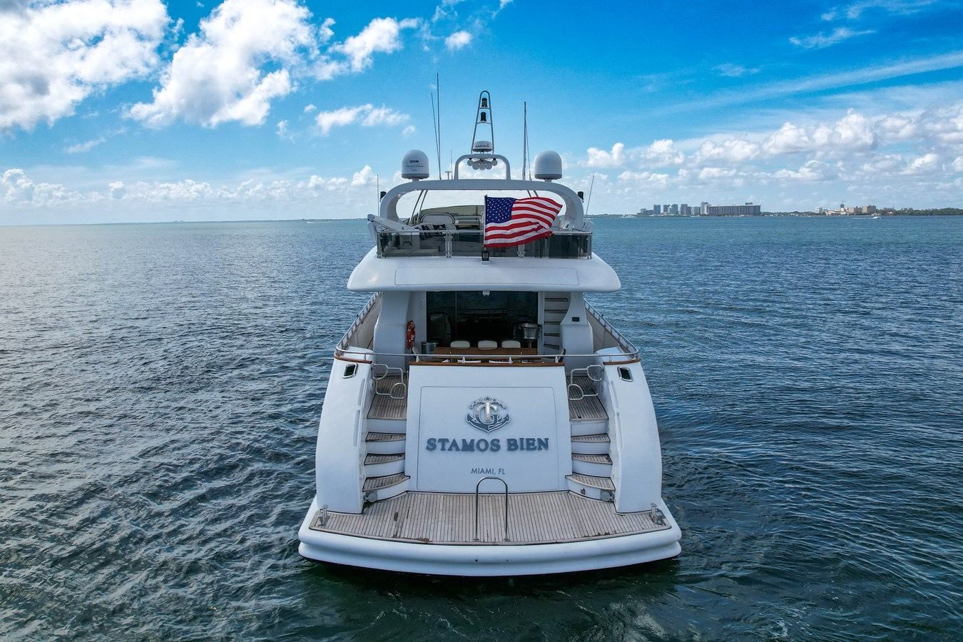 A large yacht is floating on top of a body of water.