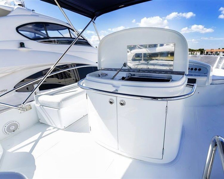 A white boat with a canopy on top of it